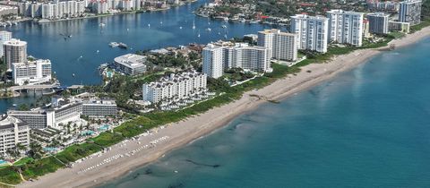 Condo towers along the beach in Boca Raton seen from above, with Lake Boca Raton and its boats beside them