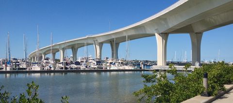 The Memorial Causeway bridge curving over a marina in Clearwater
