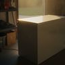 Afternoon sun falling across a chest freezer in a garage