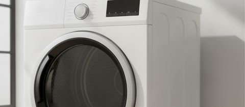 The control panel and round glass door of a white front-load dryer