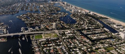 Fort Lauderdale from the air: canal streets and boats on the Intracoastal Waterway, with towers along the beach and the ocean beyond